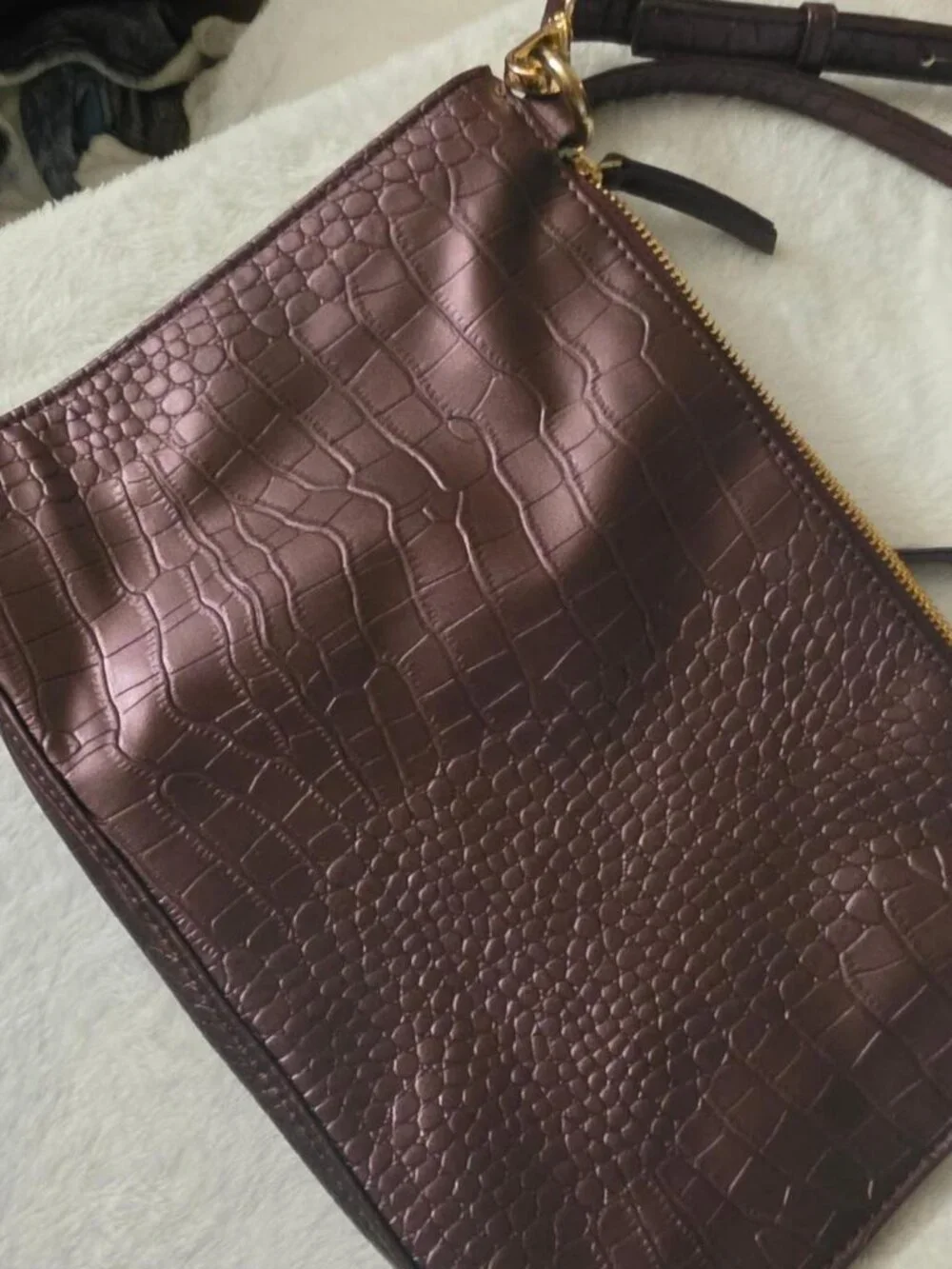 Burgundy crocodile textured leather crossbody bag with gold hardware
